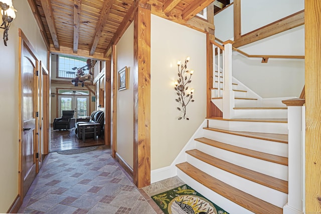 72 Indian Spring Rd, Woodstock, CT 06281 - stairs with beamed ceiling, wooden ceiling, stone finish flooring, baseboards, and french doors