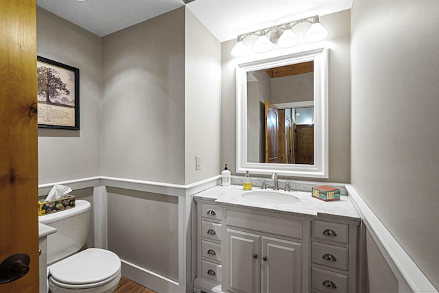 72 Indian Spring Rd, Woodstock, CT 06281 - bathroom featuring wood finished floors, vanity, and toilet