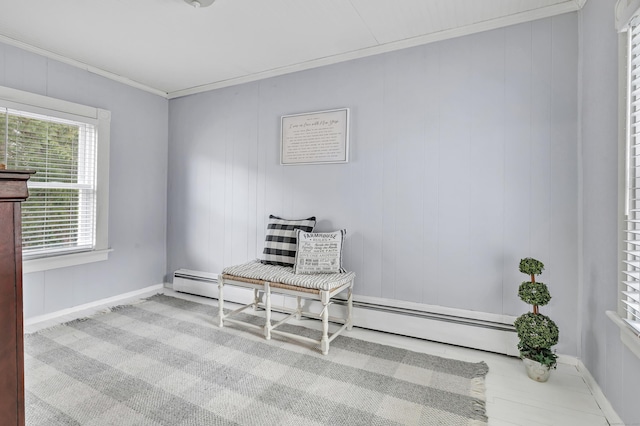home office featuring baseboard heating, baseboards, and crown molding