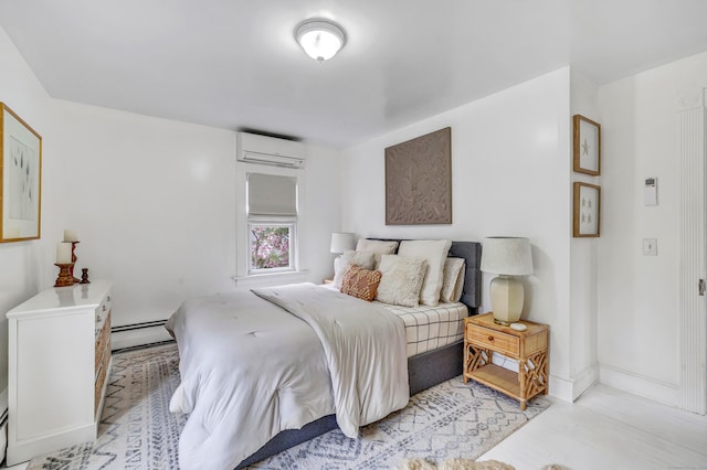 bedroom featuring a baseboard heating unit, a wall mounted air conditioner, baseboards, and wood finished floors