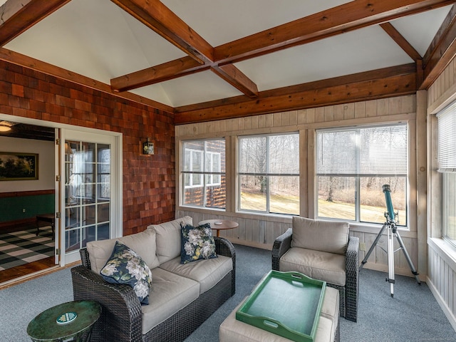 sunroom / solarium with outdoor lounge area and beam ceiling