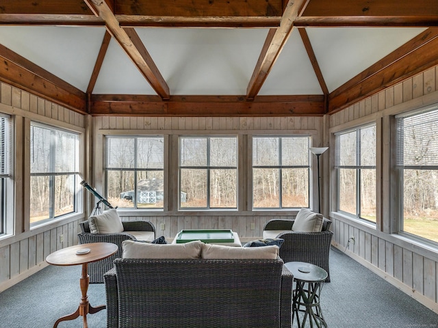 sunroom with outdoor lounge area and beam ceiling
