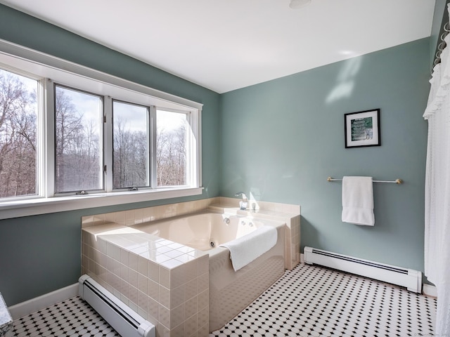 full bath with a baseboard radiator, baseboards, and a garden tub
