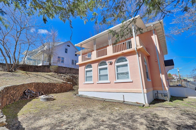639 Cooke St, Waterbury, CT 06710 - view of property exterior with a balcony and stucco siding