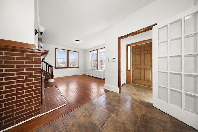639 Cooke St, Waterbury, CT 06710 - foyer entrance with baseboards, ornamental molding, dark wood-style floors, stairway, and radiator heating unit