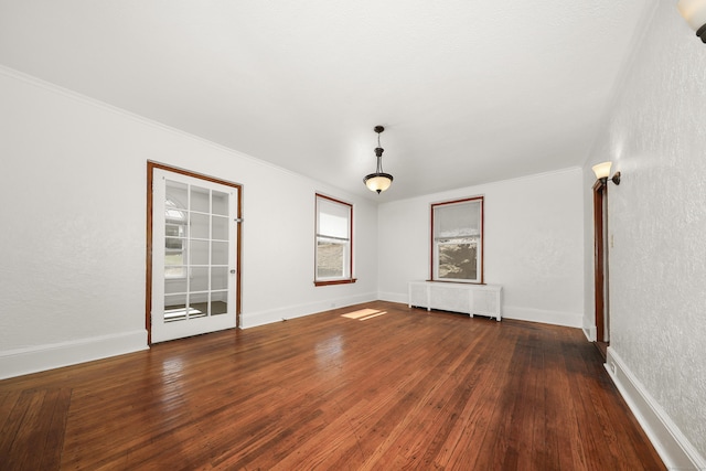 639 Cooke St, Waterbury, CT 06710 - empty room featuring hardwood / wood-style floors, radiator heating unit, crown molding, and baseboards