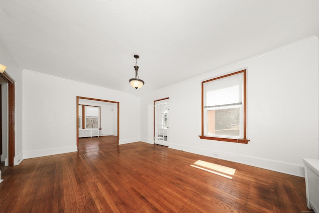 639 Cooke St, Waterbury, CT 06710 - unfurnished room with crown molding, wood-type flooring, baseboards, and radiator
