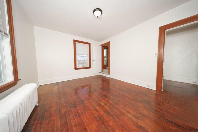 639 Cooke St, Waterbury, CT 06710 - interior space with ornamental molding, baseboards, radiator, and hardwood / wood-style floors