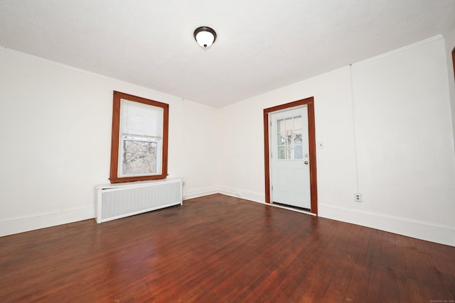 639 Cooke St, Waterbury, CT 06710 - unfurnished room featuring radiator, wood finished floors, and baseboards
