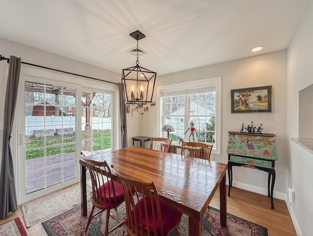 dining room featuring recessed lighting, visible vents, baseboards, a chandelier, and light wood-style flooring