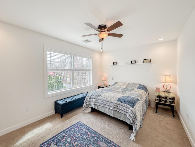 bedroom with visible vents, carpet flooring, baseboards, and ceiling fan