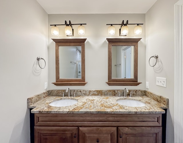 full bathroom featuring a sink and double vanity