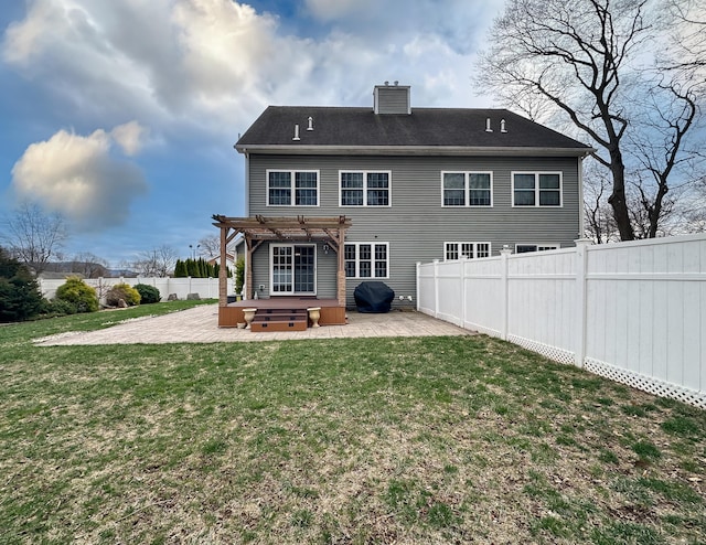 rear view of house featuring a fenced backyard, a jacuzzi, a pergola, and a patio area