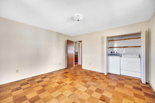 interior space featuring independent washer and dryer and baseboards