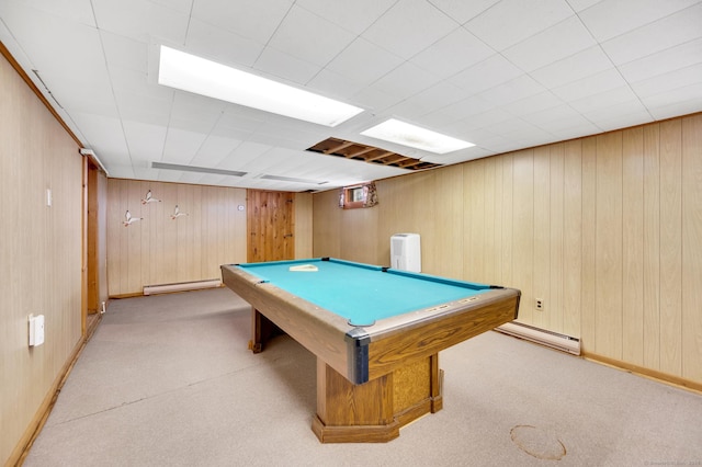 rec room featuring light carpet, wooden walls, a baseboard radiator, and billiards