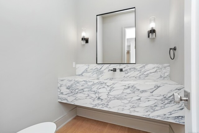 11 Tierney Ln, Westport, CT 06880 - bathroom with toilet, vanity, wood finished floors, and baseboards