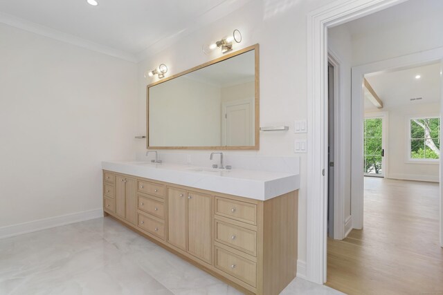 11 Tierney Ln, Westport, CT 06880 - bathroom with double vanity, baseboards, ornamental molding, and recessed lighting