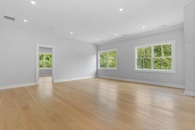 11 Tierney Ln, Westport, CT 06880 - spare room featuring healthy amount of natural light, light wood-style flooring, recessed lighting, and baseboards