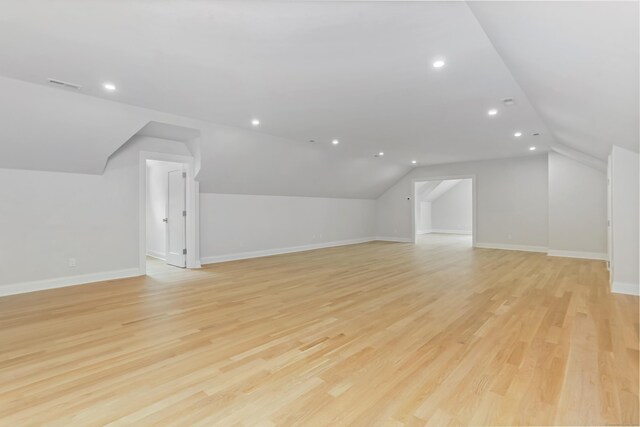 11 Tierney Ln, Westport, CT 06880 - additional living space featuring lofted ceiling, recessed lighting, baseboards, and light wood-style flooring
