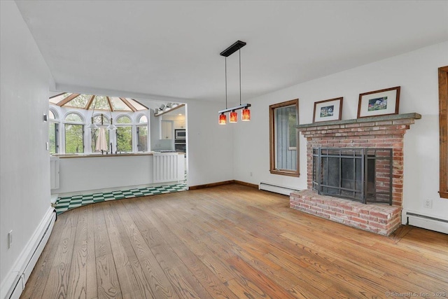 89 E St, Morris, CT 06763 - unfurnished living room featuring a baseboard radiator, hardwood / wood-style floors, a brick fireplace, and baseboards
