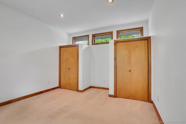 89 E St, Morris, CT 06763 - unfurnished bedroom with light colored carpet, baseboards, and recessed lighting