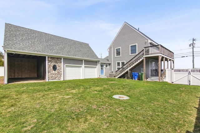 75 N Main St, East Hampton, CT 06424 - back of house with a gate, an outdoor structure, stairs, roof with shingles, and a deck
