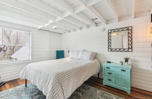 75 N Main St, East Hampton, CT 06424 - bedroom featuring dark wood-style floors, wooden walls, and beamed ceiling
