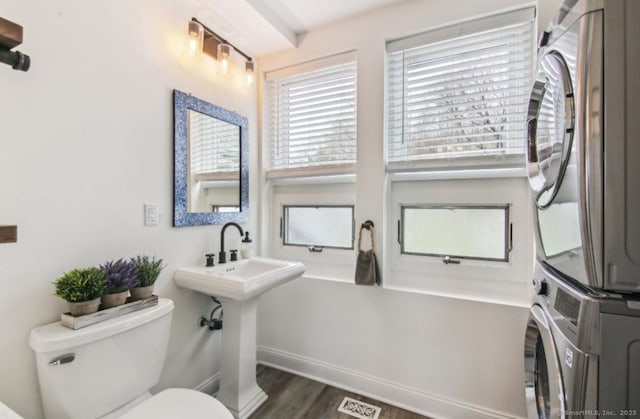 75 N Main St, East Hampton, CT 06424 - bathroom with estacked washer and dryer and wood finished floors
