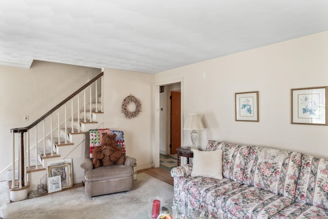 living room featuring stairs