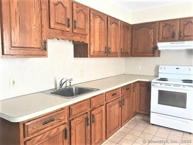14 Court St, West Haven, CT 06516 - kitchen with brown cabinetry, under cabinet range hood, light countertops, a sink, and white electric stove