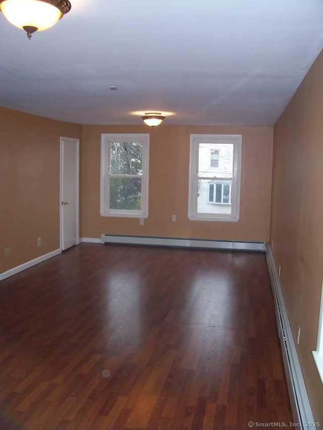 14 Court St, West Haven, CT 06516 - unfurnished room with dark wood-type flooring, a wealth of natural light, baseboards, and baseboard heating