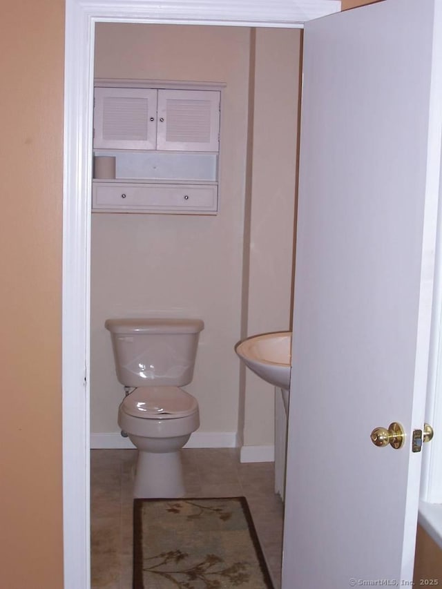 14 Court St, West Haven, CT 06516 - bathroom with tile patterned flooring, baseboards, and toilet