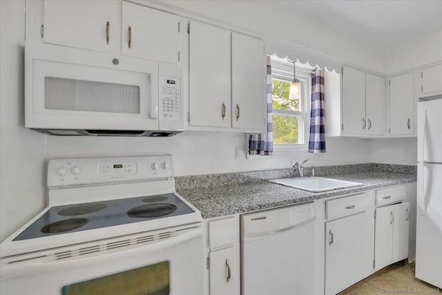 kitchen with white appliances, a sink, white cabinets, and light countertops
