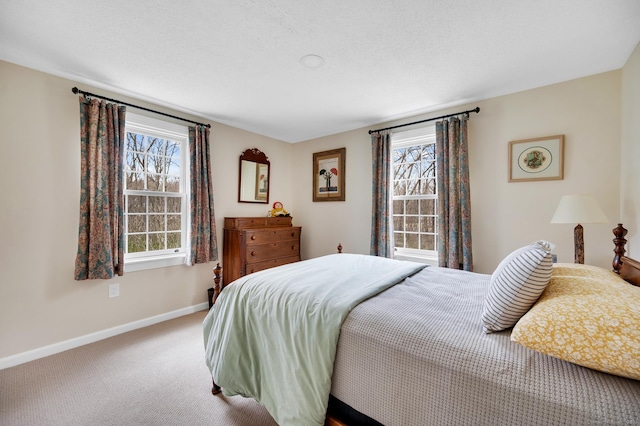 carpeted bedroom with baseboards