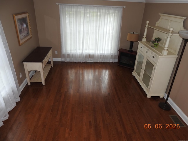 70 Allison Way Unit 70, East Haven, CT 06512 - unfurnished living room featuring baseboards and dark wood-style flooring
