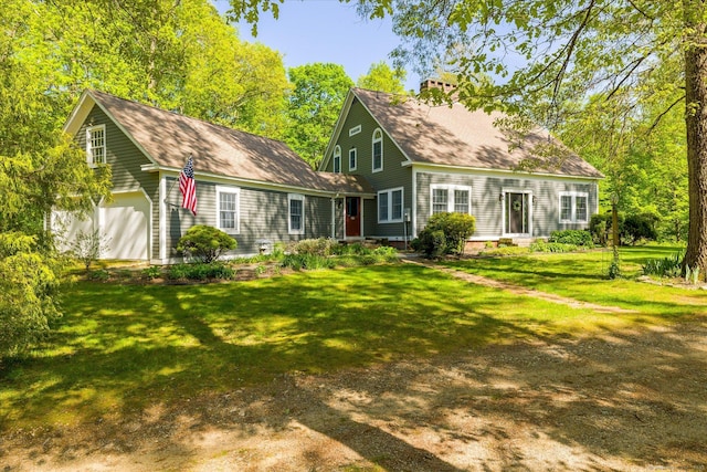 128 Spaulding Rd, Brooklyn, CT 06234 - rear view of property featuring a lawn, a shingled roof, a chimney, and a garage