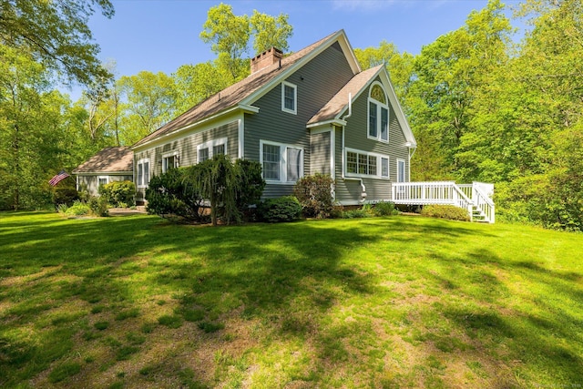 128 Spaulding Rd, Brooklyn, CT 06234 - rear view of house featuring a chimney, a deck, and a lawn