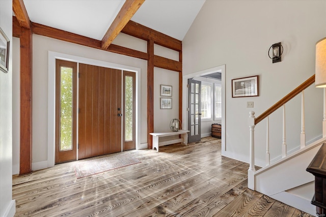 128 Spaulding Rd, Brooklyn, CT 06234 - foyer entrance with wood finished floors, stairs, beam ceiling, baseboards, and high vaulted ceiling