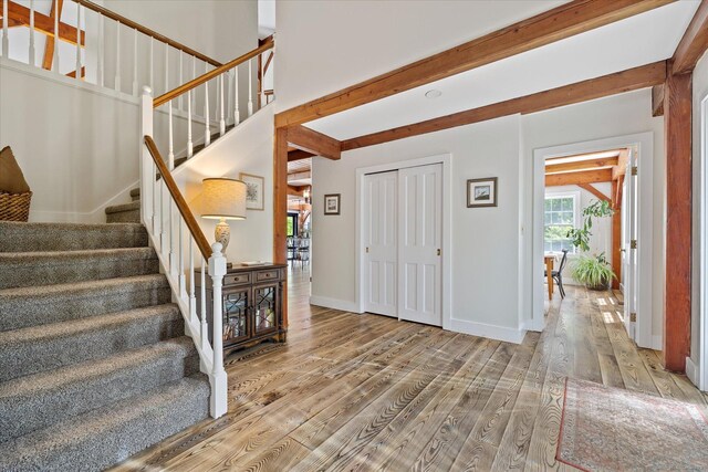 128 Spaulding Rd, Brooklyn, CT 06234 - entrance foyer with wood finished floors, stairway, baseboards, and beamed ceiling