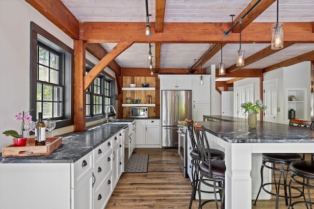 128 Spaulding Rd, Brooklyn, CT 06234 - kitchen with appliances with stainless steel finishes, beam ceiling, open shelves, dark wood-type flooring, and white cabinetry