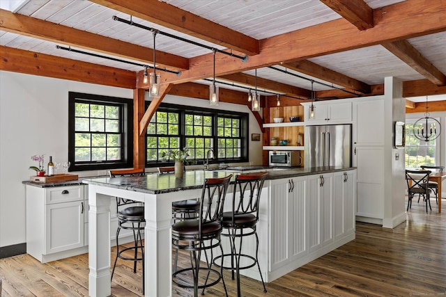 128 Spaulding Rd, Brooklyn, CT 06234 - kitchen with appliances with stainless steel finishes, wood finished floors, plenty of natural light, white cabinets, and wooden ceiling