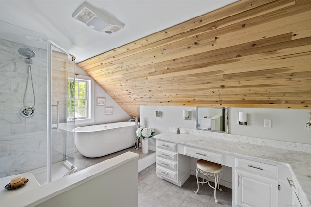 128 Spaulding Rd, Brooklyn, CT 06234 - bathroom with a stall shower, a freestanding bath, lofted ceiling, vanity, and tile patterned floors
