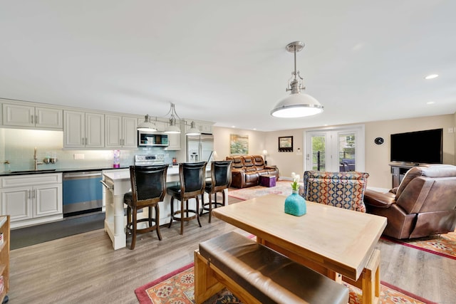 340 Brookfield St, South Windsor, CT 06074 - dining space with light wood finished floors and recessed lighting