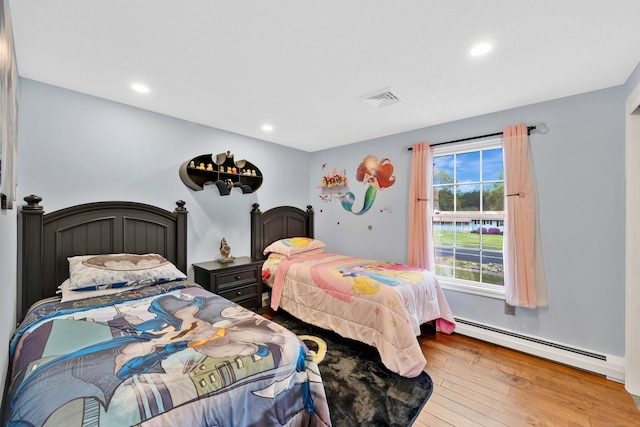 340 Brookfield St, South Windsor, CT 06074 - bedroom with a baseboard heating unit, wood finished floors, and recessed lighting