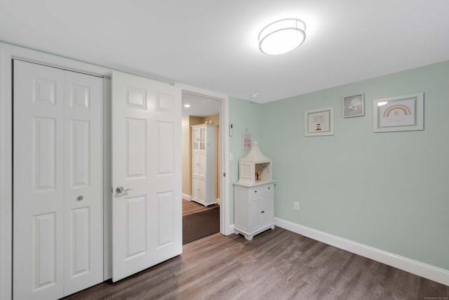 340 Brookfield St, South Windsor, CT 06074 - unfurnished bedroom with wood finished floors, baseboards, and a closet