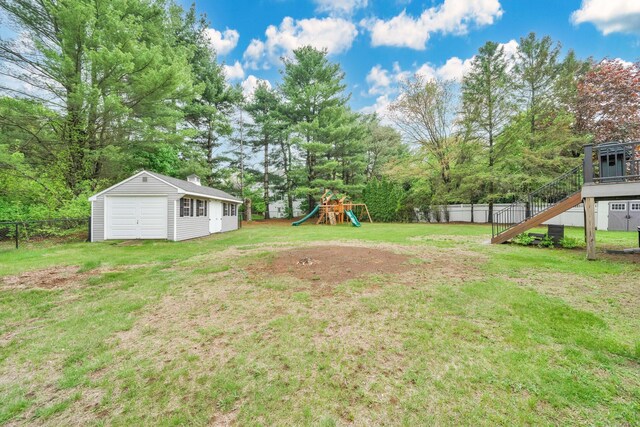 340 Brookfield St, South Windsor, CT 06074 - view of yard with stairs, a playground, a detached garage, an outdoor structure, and view of scattered trees