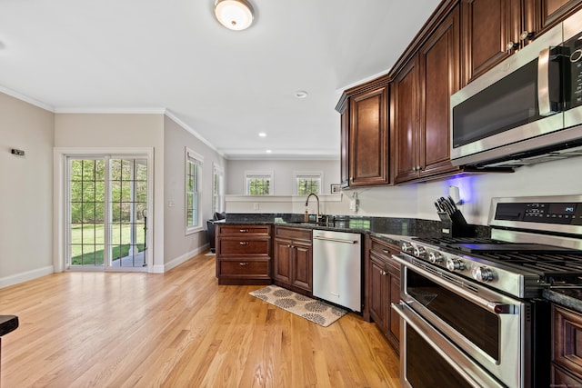 31 Cambridge Ct, Colchester, CT 06415 - kitchen with appliances with stainless steel finishes, a sink, crown molding, light wood-style floors, and baseboards
