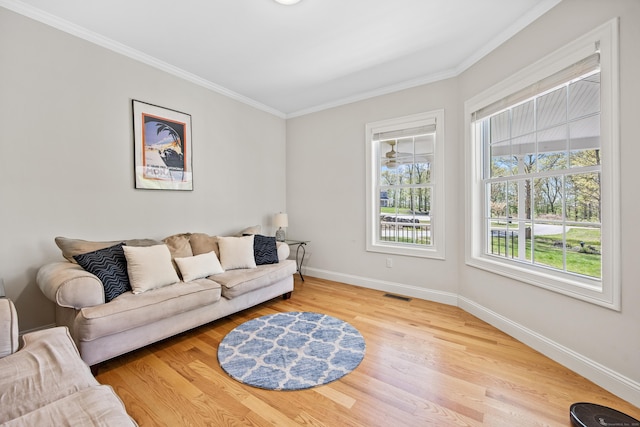 31 Cambridge Ct, Colchester, CT 06415 - living area featuring baseboards, ornamental molding, and wood finished floors
