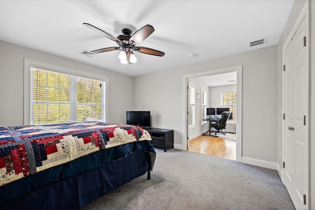 31 Cambridge Ct, Colchester, CT 06415 - carpeted bedroom featuring a desk, multiple windows, and baseboards