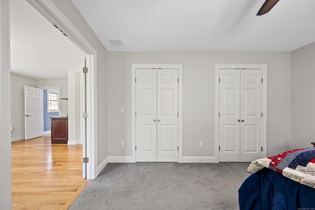31 Cambridge Ct, Colchester, CT 06415 - bedroom featuring multiple closets, baseboards, and ceiling fan